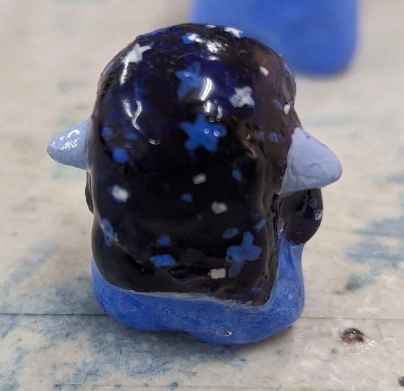 back of cosmic miniature