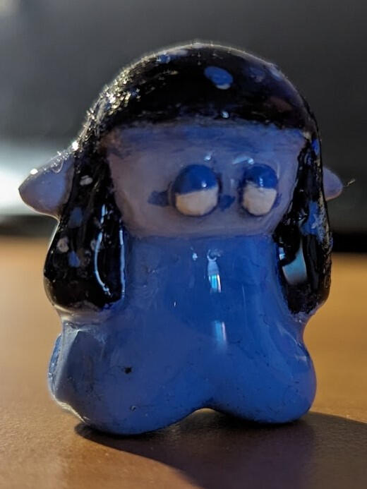 A tiny 1 1/2 inch miniature of cosmic!